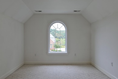 This Stately, all brick colonial is situated on over 1/2 acre on Pete Dye River Course of Virginia Tech in Virginia - for sale on GolfHomes.com, golf home, golf lot