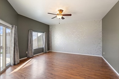 Step inside a residence that blends comfort with a polished on Sun City Lakes West and East in Arizona - for sale on GolfHomes.com, golf home, golf lot