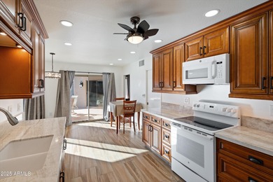 Step inside a residence that blends comfort with a polished on Sun City Lakes West and East in Arizona - for sale on GolfHomes.com, golf home, golf lot