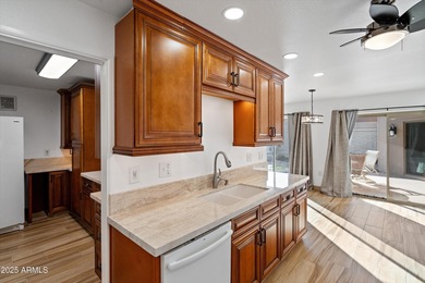 Step inside a residence that blends comfort with a polished on Sun City Lakes West and East in Arizona - for sale on GolfHomes.com, golf home, golf lot