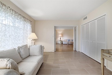 Discover sweeping golf course views from this desirable on Palm-Aire Country Club and Resort - The Oaks in Florida - for sale on GolfHomes.com, golf home, golf lot