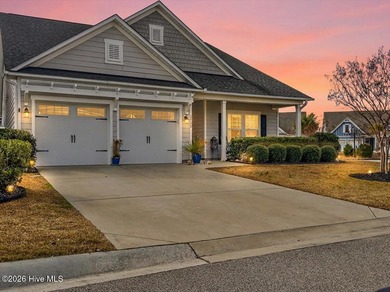 The welcoming front porch sets the tone for this beautiful home on Members Club At St. James Plantation in North Carolina - for sale on GolfHomes.com, golf home, golf lot