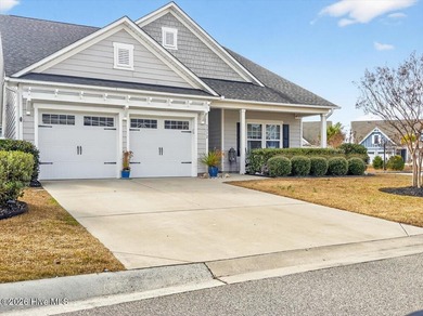 The welcoming front porch sets the tone for this beautiful home on Members Club At St. James Plantation in North Carolina - for sale on GolfHomes.com, golf home, golf lot