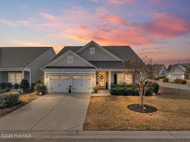 The welcoming front porch sets the tone for this beautiful home on Members Club At St. James Plantation in North Carolina - for sale on GolfHomes.com, golf home, golf lot