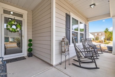 The welcoming front porch sets the tone for this beautiful home on Members Club At St. James Plantation in North Carolina - for sale on GolfHomes.com, golf home, golf lot