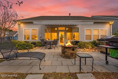 The welcoming front porch sets the tone for this beautiful home on Members Club At St. James Plantation in North Carolina - for sale on GolfHomes.com, golf home, golf lot