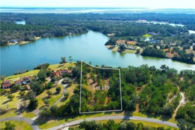 Enjoy the privacy and beauty of this stunning lakefront homesite on Frederica Golf Club in Georgia - for sale on GolfHomes.com, golf home, golf lot