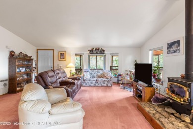 Tucked back on a secluded 1 acre lot sits this 3 bedroom 3 bath on Star Valley RV Golf Course in Wyoming - for sale on GolfHomes.com, golf home, golf lot