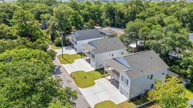 Welcome to your new beach house paradise! This new construction on Beachwood Golf Club in South Carolina - for sale on GolfHomes.com, golf home, golf lot