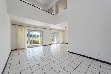 Enjoy breathtaking views of the lake and golf course from this on  in Florida - for sale on GolfHomes.com, golf home, golf lot