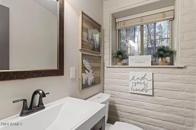 Imagine a home where every detail reflects a commitment to on Pinetop Lakes Country Club in Arizona - for sale on GolfHomes.com, golf home, golf lot