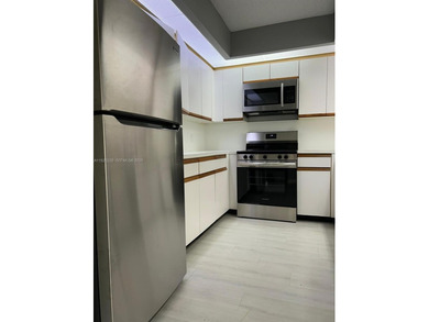 Beautiful 1/1.5 condo whit 1045 sf Living area in a gated on Flamingo Lakes Country Club in Florida - for sale on GolfHomes.com, golf home, golf lot