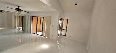 Lovely townhome. It features fresh paint, new porcelain tile on on Woodmont Country Club in Florida - for sale on GolfHomes.com, golf home, golf lot