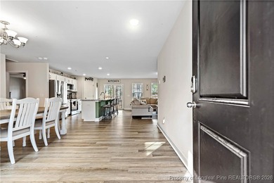 Built in 2024 and thoughtfully enhanced beyond the builder's on Carolina Trace Country Club in North Carolina - for sale on GolfHomes.com, golf home, golf lot