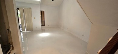 Lovely townhome. It features fresh paint, new porcelain tile on on Woodmont Country Club in Florida - for sale on GolfHomes.com, golf home, golf lot