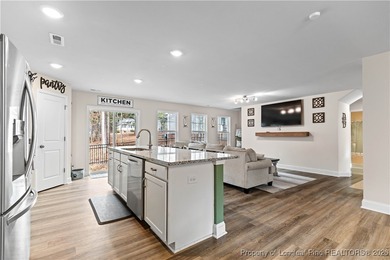 Built in 2024 and thoughtfully enhanced beyond the builder's on Carolina Trace Country Club in North Carolina - for sale on GolfHomes.com, golf home, golf lot