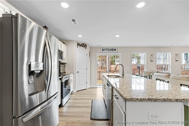 Built in 2024 and thoughtfully enhanced beyond the builder's on Carolina Trace Country Club in North Carolina - for sale on GolfHomes.com, golf home, golf lot