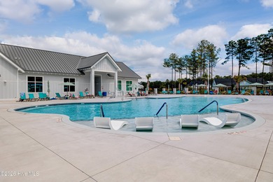 Experience elegant, low-maintenance living in this stunning on Cape Fear National At Brunswick Forest in North Carolina - for sale on GolfHomes.com, golf home, golf lot