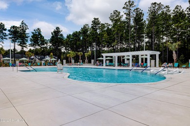 Experience elegant, low-maintenance living in this stunning on Cape Fear National At Brunswick Forest in North Carolina - for sale on GolfHomes.com, golf home, golf lot