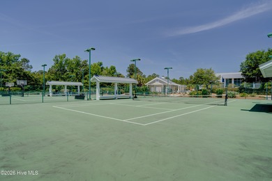 Experience elegant, low-maintenance living in this stunning on Cape Fear National At Brunswick Forest in North Carolina - for sale on GolfHomes.com, golf home, golf lot