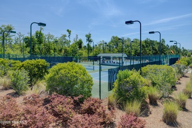 Experience elegant, low-maintenance living in this stunning on Cape Fear National At Brunswick Forest in North Carolina - for sale on GolfHomes.com, golf home, golf lot