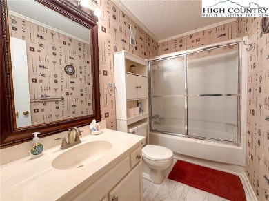 Beautifully updated turnkey unit with luxury vinal plank floors on Beech Mountain Club in North Carolina - for sale on GolfHomes.com, golf home, golf lot