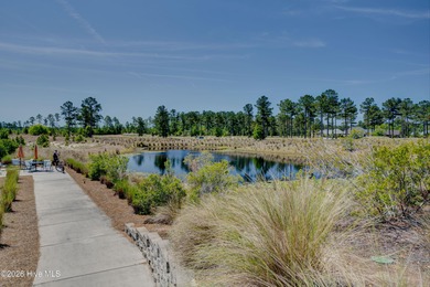 Experience elegant, low-maintenance living in this stunning on Cape Fear National At Brunswick Forest in North Carolina - for sale on GolfHomes.com, golf home, golf lot