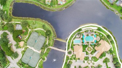 Discover the splendor of this exquisite lakeside residence on Arrowhead Golf Club At Heritage Greens in Florida - for sale on GolfHomes.com, golf home, golf lot