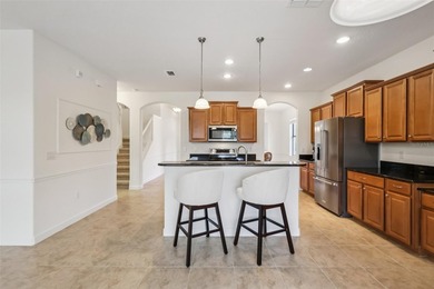 Welcome to 8920 Dove Valley Way, a spacious five-bedroom on The Oasis Club at Champions Gate in Florida - for sale on GolfHomes.com, golf home, golf lot