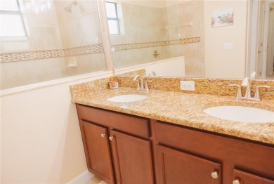Golf, Gather, and Get Away, Right at Home in ChampionsGate on The Oasis Club at Champions Gate in Florida - for sale on GolfHomes.com, golf home, golf lot