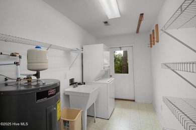 Nestled in a private setting at the end of a cul-de-sac, this on The Country Club of the Crystal Coast in North Carolina - for sale on GolfHomes.com, golf home, golf lot