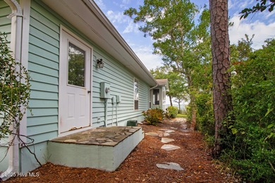 Nestled in a private setting at the end of a cul-de-sac, this on The Country Club of the Crystal Coast in North Carolina - for sale on GolfHomes.com, golf home, golf lot