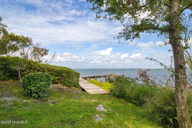 Nestled in a private setting at the end of a cul-de-sac, this on The Country Club of the Crystal Coast in North Carolina - for sale on GolfHomes.com, golf home, golf lot