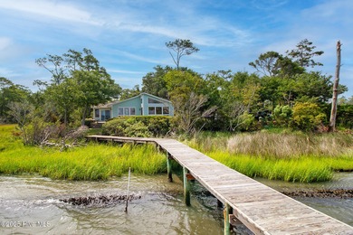Nestled in a private setting at the end of a cul-de-sac, this on The Country Club of the Crystal Coast in North Carolina - for sale on GolfHomes.com, golf home, golf lot
