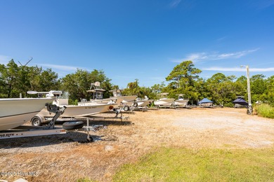 Nestled in a private setting at the end of a cul-de-sac, this on The Country Club of the Crystal Coast in North Carolina - for sale on GolfHomes.com, golf home, golf lot