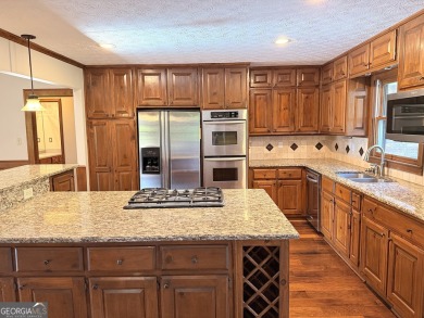 This well-maintained four-sided brick home features hardwood on Honey Creek Country Club in Georgia - for sale on GolfHomes.com, golf home, golf lot