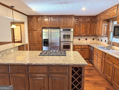 This well-maintained four-sided brick home features hardwood on Honey Creek Country Club in Georgia - for sale on GolfHomes.com, golf home, golf lot