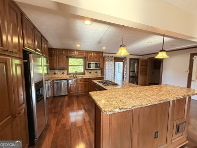 This well-maintained four-sided brick home features hardwood on Honey Creek Country Club in Georgia - for sale on GolfHomes.com, golf home, golf lot