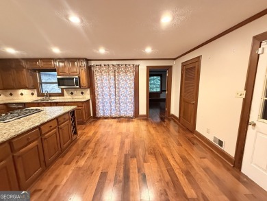 This well-maintained four-sided brick home features hardwood on Honey Creek Country Club in Georgia - for sale on GolfHomes.com, golf home, golf lot