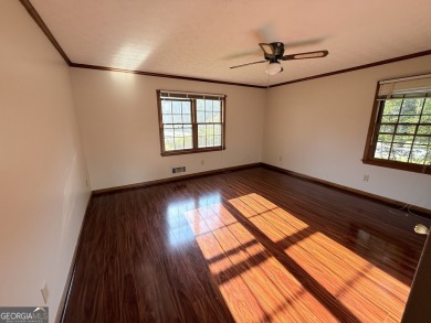 This well-maintained four-sided brick home features hardwood on Honey Creek Country Club in Georgia - for sale on GolfHomes.com, golf home, golf lot