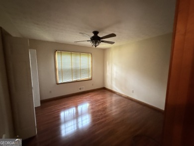 This well-maintained four-sided brick home features hardwood on Honey Creek Country Club in Georgia - for sale on GolfHomes.com, golf home, golf lot
