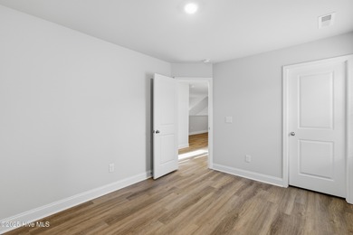 The Kent is a stunning open-concept home designed for effortless on Harbour Point Golf Club in North Carolina - for sale on GolfHomes.com, golf home, golf lot