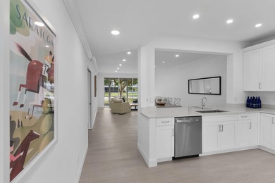 Enjoy refined living in this fully renovated end-unit residence on Glen Eagle Golf and Country Club in Florida - for sale on GolfHomes.com, golf home, golf lot