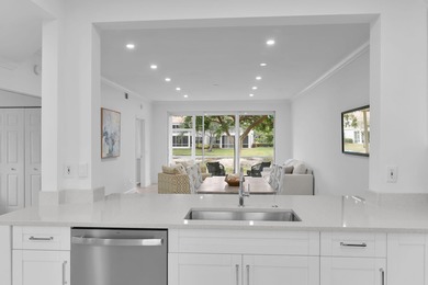 Enjoy refined living in this fully renovated end-unit residence on Glen Eagle Golf and Country Club in Florida - for sale on GolfHomes.com, golf home, golf lot