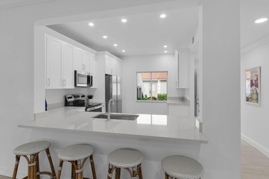 Enjoy refined living in this fully renovated end-unit residence on Glen Eagle Golf and Country Club in Florida - for sale on GolfHomes.com, golf home, golf lot