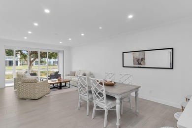 Enjoy refined living in this fully renovated end-unit residence on Glen Eagle Golf and Country Club in Florida - for sale on GolfHomes.com, golf home, golf lot