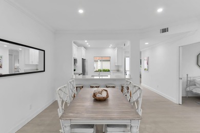 Enjoy refined living in this fully renovated end-unit residence on Glen Eagle Golf and Country Club in Florida - for sale on GolfHomes.com, golf home, golf lot