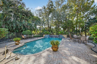 Located on an exceptional corner lot, this magnificent BAYVIEW on Wycliffe Golf and Country Club in Florida - for sale on GolfHomes.com, golf home, golf lot