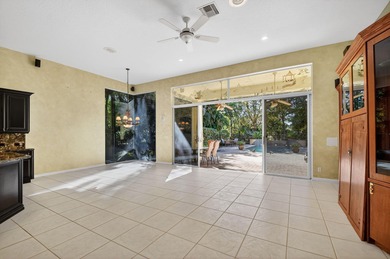 Located on an exceptional corner lot, this magnificent BAYVIEW on Wycliffe Golf and Country Club in Florida - for sale on GolfHomes.com, golf home, golf lot