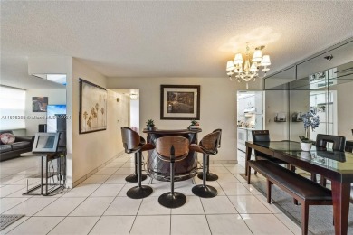 Lovely condo offers a perfect blend of comfort and convenience on Pembroke Lakes Golf Club in Florida - for sale on GolfHomes.com, golf home, golf lot